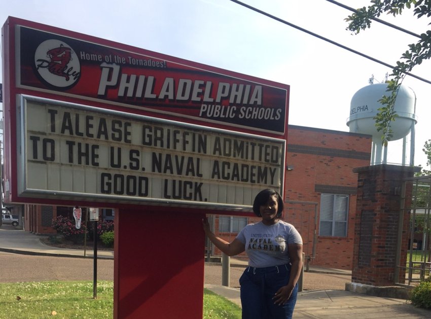 Philadelphia High School’s Talease Griffin stands in front of the school’s sign that congratulates her recent acceptance to the U.S. Naval Academy.